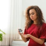 diabetic woman testing blood